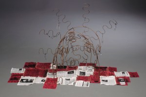 Not Here Now, 2012, metal, transparency paper and textiles, 30" x 60" x 22"